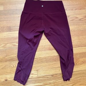 Woman’s maroon lululemon leggings